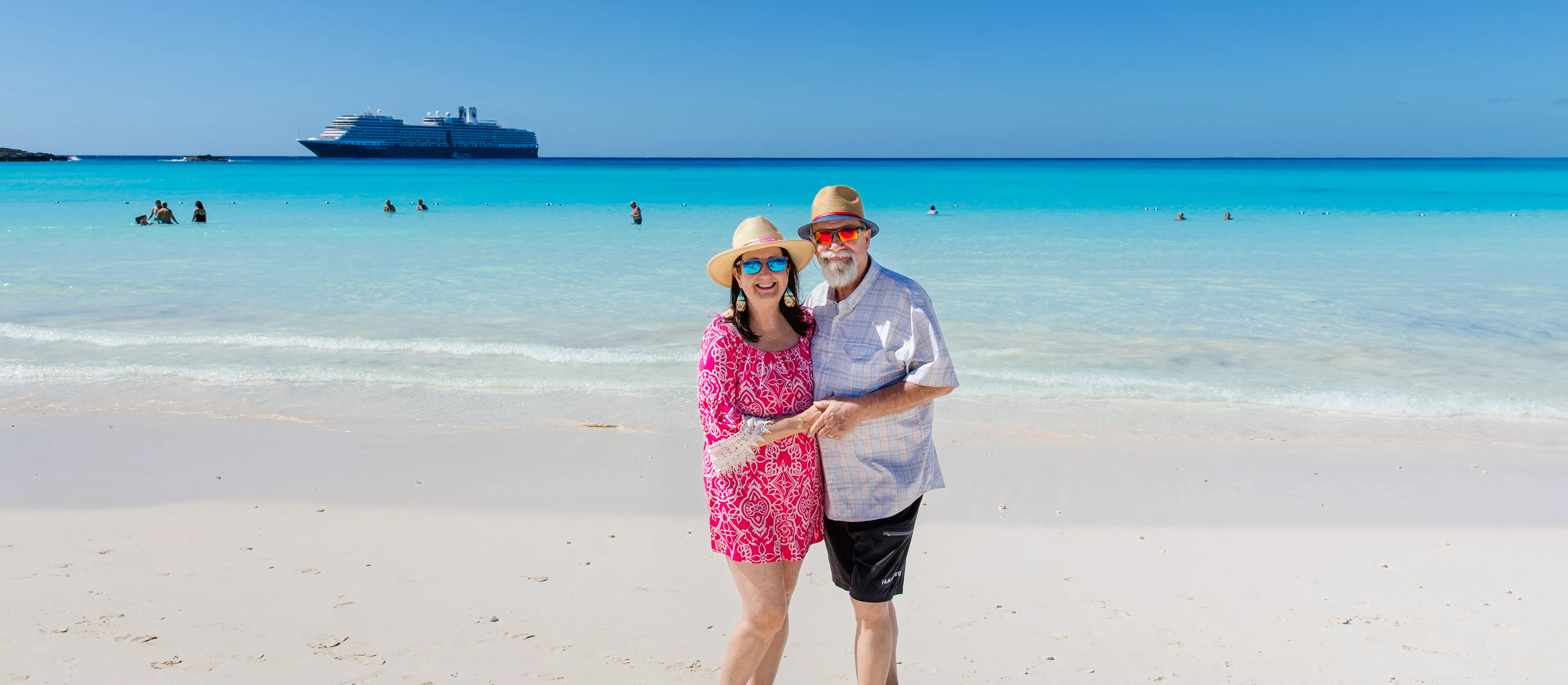 A couple standing together on the beach