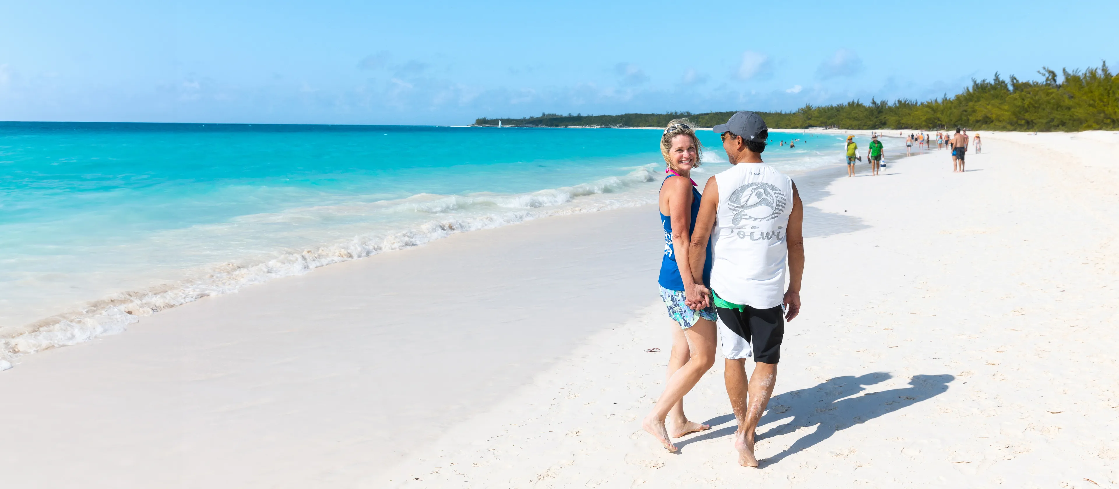 A couple walking together on the beach