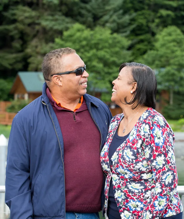 A couple looking at each other and smiling