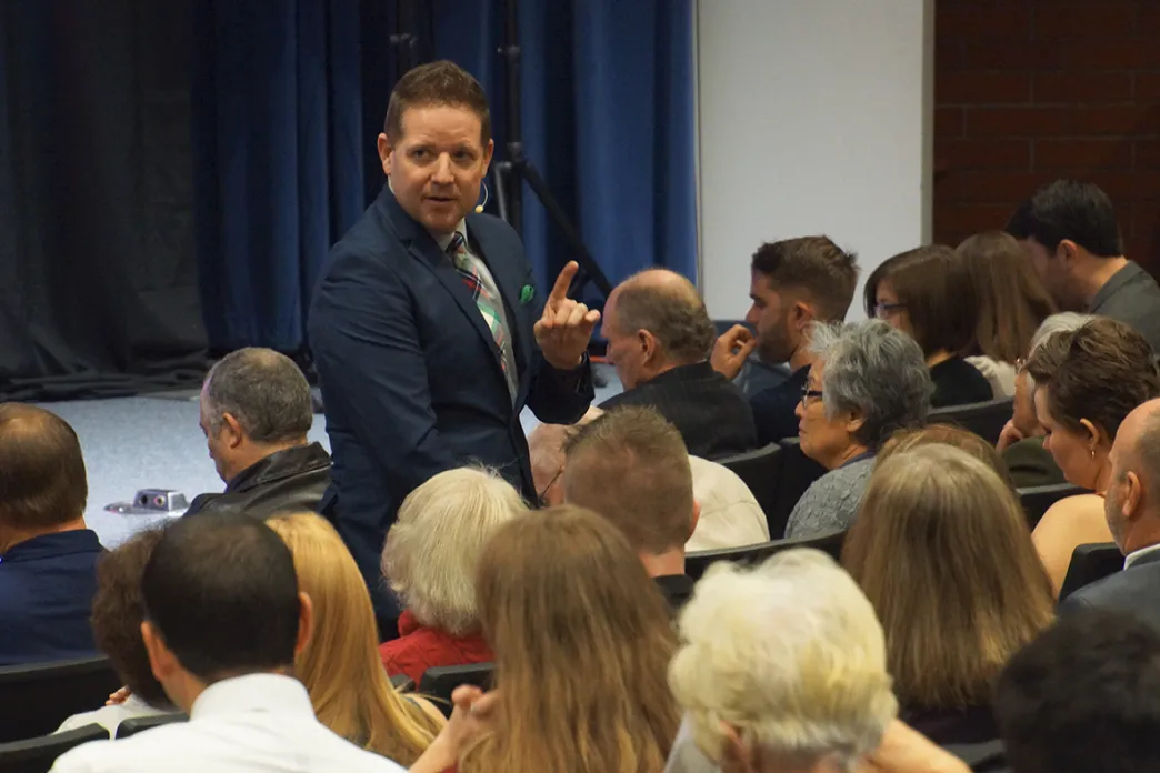 Roy Ice speaking to a group of people