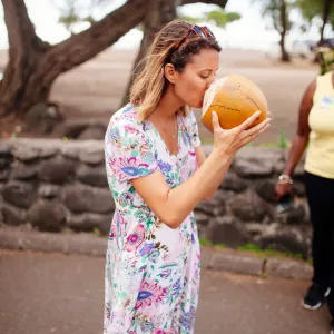 drinking from a coconut