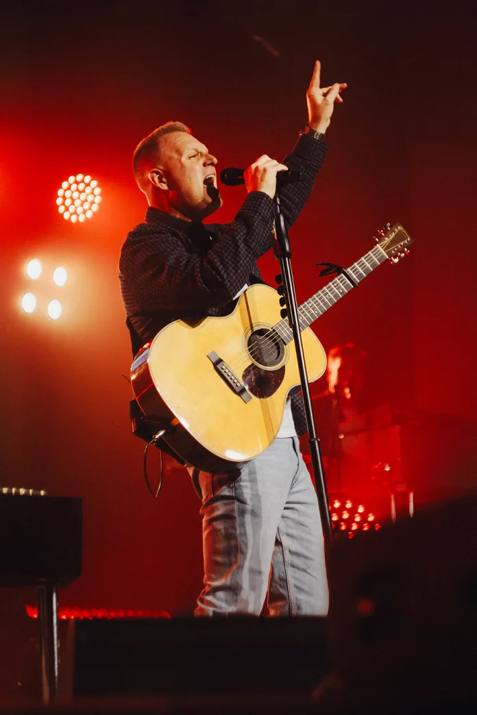 Matthew West singing on a stage
