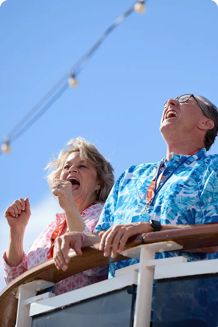 A couple smiling and cheering
