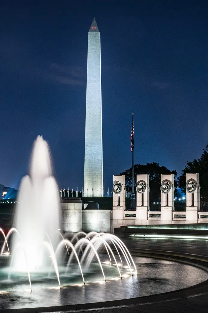 View of the fountain in the World War II Memorial in Washington, DC with the Washington Monument in the background