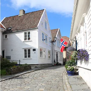 Quaint, white houses along a cobblestone street