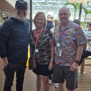 MercyMe band member take a photo with two travelers